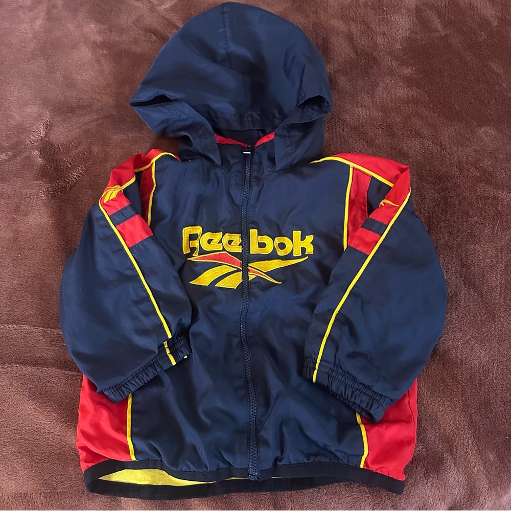 199 Vintage Reebok Kids Navy Hooded Windbreaker with Red & Yellow Accents